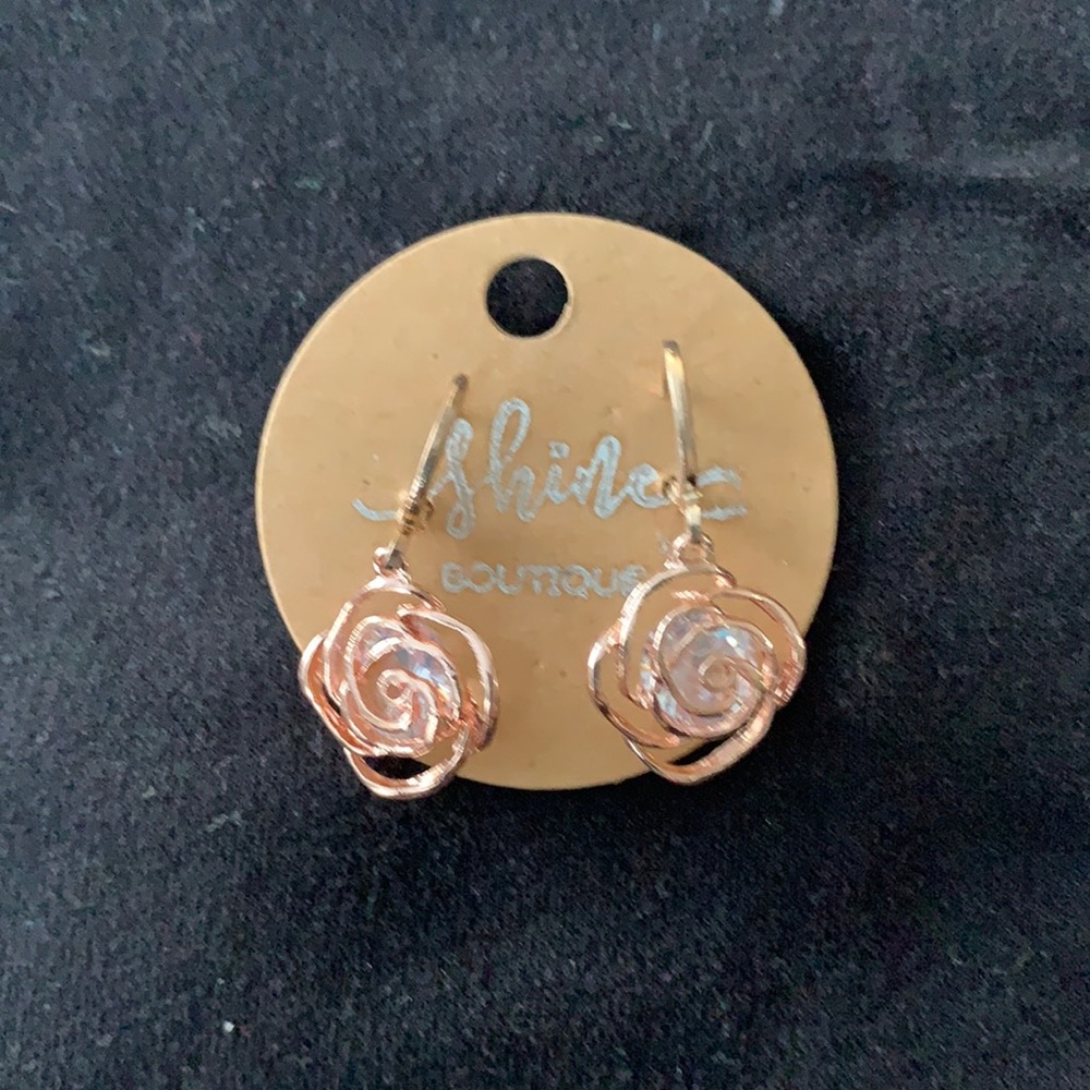 5/$25 Rosegold floral pierced earring with croak center. Just over one inch long